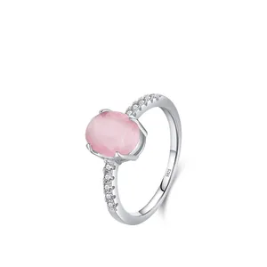 S925 sterling silver ring with pink cat eye stone and white zircons on white background