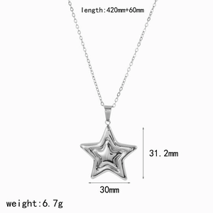 Detail view of a 18k gold star pendant showing specific size dimensions and measurements