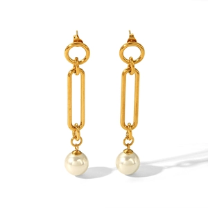 Detailed close-up of gold titanium steel earrings with white faux pearls and long links