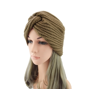 Detail of cross-knot design on dark coffee knit bohemian turban beanie for women