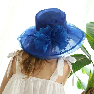 Detailed back view of a royal blue organza sun hat with a large 3D flower decoration