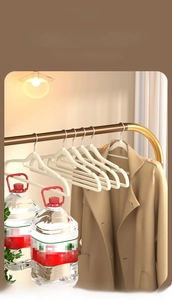 Strong load-bearing white flocked hanger showing heavy weight capacity with water jugs