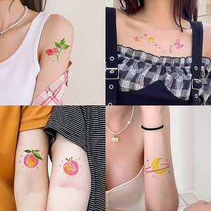 Colorful fresh temporary tattoos featuring cute fruit and butterfly patterns in crayon style
