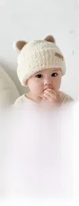 Detail of warm baby winter hat featuring soft plush fabric and cute brown bear ears