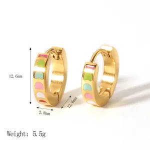 Close-up of 18K gold plated stainless steel hoops with colorful enamel drip patterns