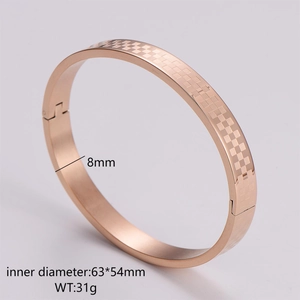 Detail of rose gold checkered bangle showing 8mm width and 63x54mm inner dimensions