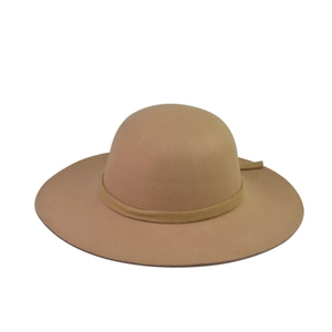 Detail of camel wool felt fedora with elegant round crown and decorative ribbon band