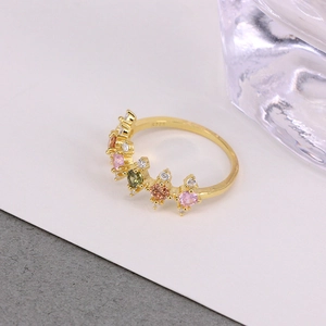 Macro shot of S925 hallmark on gold luxury ring set with vibrant colorful gemstones