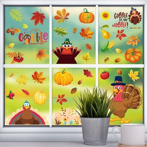 Detail showing Thanksgiving window clings with turkeys and pumpkins on glass pane