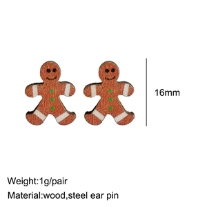 Festive gingerbread man wooden stud earrings with steel pins on a clean white background