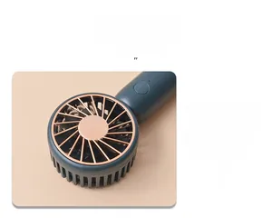 Detail view of teal portable USB fan featuring copper-gold electroplated protective mesh