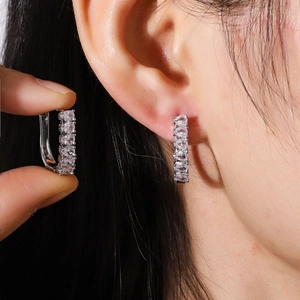 Silver U-shaped geometric hoop earrings with sparkling round cubic zirconia inlay