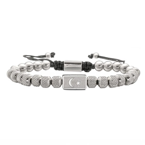 Handmade woven bracelet with star moon charm and silver-colored beads on black cord