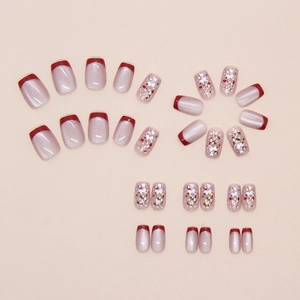 Macro shot of French cat-eye red glitter press-on nails in various sizes