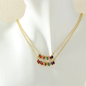 Detailed close-up of double-layered gold chain with colorful marquise-cut zircon gems
