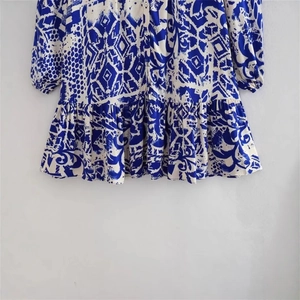 Slim fit blue and white floral print dress with ruffle hem and button-front design