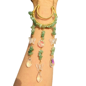 Golden moon sun catcher with natural green crystal chips and butterfly pendant detail