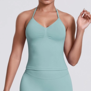 Detail of light green seamless ribbed yoga top and leggings with halter neck design