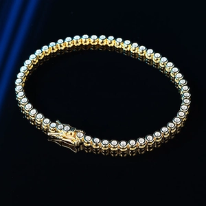 Elegant 2mm moissanite tennis bracelet in gold finish with round cut stones