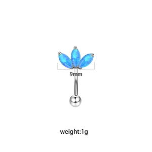 Macro detail of 9mm eyebrow piercing with three blue marquise stones on curved barbell