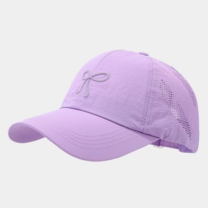 Detail of purple quick-dry baseball cap featuring breathable mesh and bow decoration
