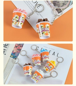 Close-up of colorful miniature popcorn bucket keychains in various vibrant shades
