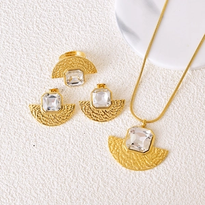 Vintage gold fan-shaped jewelry set with square crystals including necklace and earrings