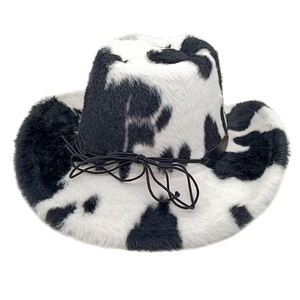 Macro detail of cow print faux fur cowboy hat showing soft texture and knotted black band