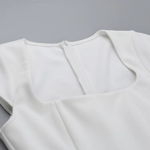 Detail of square neckline and back invisible zipper on a white textured A-line mini dress