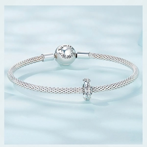 Detailed macro view of silver mesh chain bracelet with Family Forever engraved charm clasp