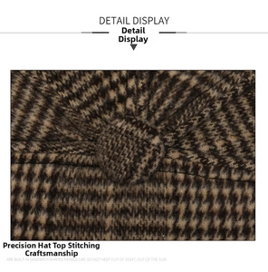 Detail view of the houndstooth pattern and reinforced stitching on the vintage flat cap