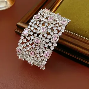 Luxury open hollow bangle with sparkling pink gemstones and zircons in palace style