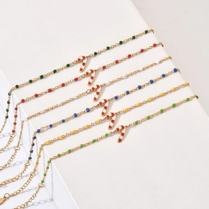 Golden Christmas bracelet set with candy cane charms and colorful beads for women