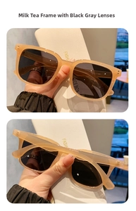 Detalle de gafas de sol cuadradas color té con leche y estuche de moda blanco