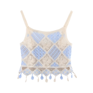 Close-up of hollow crochet knit tank top with blue diamond pattern and fringe tassels