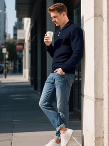 Detail of dark blue waffle knit polo shirt showing texture and buttoned collar