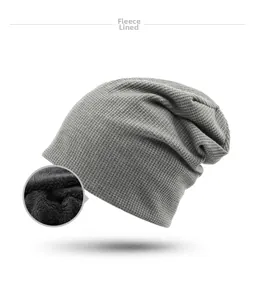 Detail view of grey waffle knit beanie showing the thick black fleece lining texture