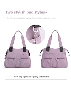 Detail of purple waterproof tote showing versatile shape with side metal hooks and zippers