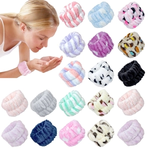 Macro view of plush coral fleece wristbands in various patterns for face washing