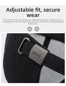 Detail of adjustable metal buckle with Sport engraving on a black cotton baseball cap