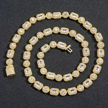 Macro detail of 19mm gold-plated hip hop Cuban link chain with sparkling rhinestones