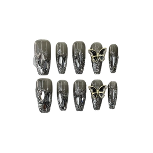 Smoky grey press-on nails with silver glitter, rhinestones, and 3D black gold butterflies