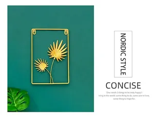 Detail showing high-quality golden iron fan leaves on a modern luxury metal wall decor
