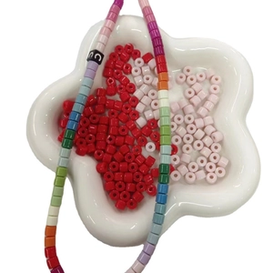 DIY 6mm acrylic cylinder beads set with alphabet charms in floral white ceramic tray