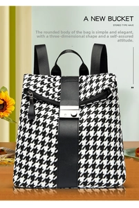 Detail eines schwarz-weißen Rucksacks mit Hahnentrittmuster und silberner Metallschnalle