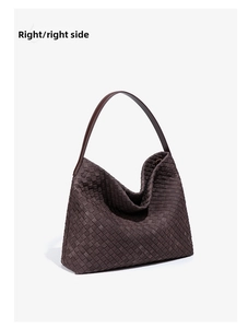 Right side view of large woven leather tote bag in dark brown with fine shoulder strap