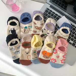 Flat lay of colorful cartoon jacquard low cut invisible socks with cute animal patterns