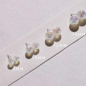 Iridescent pearl stud earrings in 8mm to 14mm sizes with elegant rainbow luster
