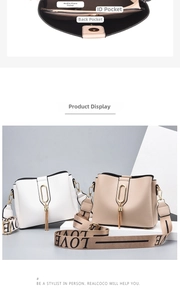 Internal view of bucket bag showing phone slot, ID pocket, and back compartment