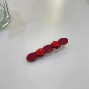 Retro dark red acetate hair clip featuring delicate 3D rose flowers and gold metal base